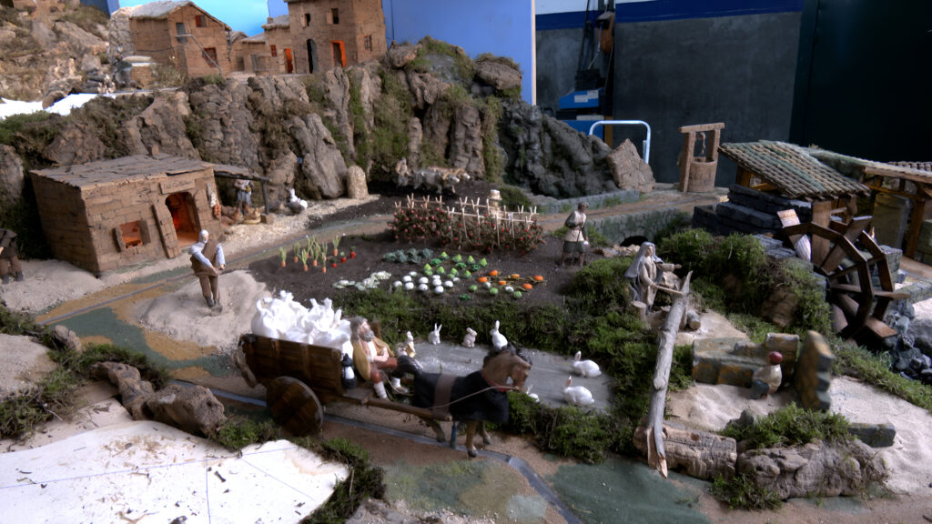 Alt: Mans que creen màgia: el batec del concurs de pessebres de l’Ateneu